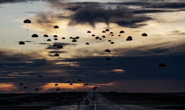 Two U.S. Air Force C-130J Super Hercules’ assigned to the 36th Airlift Squadron deployed from Yokota Air Base, Japan, drop U.S. Army and Japan Ground Self-Defense paratroopers during Exercise Forager 21 at Andersen Air Force Base, Guam, July 30, 2021. Exercise Forager 21 is a U.S. Army Pacific exercise designed to test and refine the Theater Army's ability to flow landpower forces into the theater, execute command and control of those forces, and effectively employ them in support of our allies, partners, and national security objectives in the region. Forager 21 is an opportunity for the Theater Army to exercise Joint, integrated, multi-domain operations in an archipelagic environment, and to test and employ emerging capabilities. (U.S. Air Force photo by Master Sgt. Richard P. Ebensberger)
