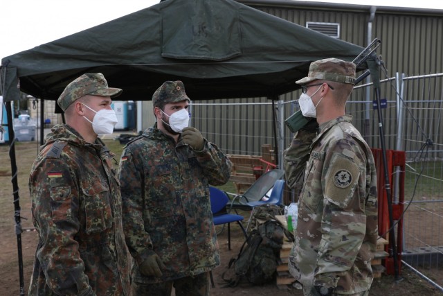 U.S. Army Pfc. Brandon Farmer with 2nd Cavalry Regiment, (right), German Sgt. Stefan Bujung (center) and German Spc. Kevin Wachtler (left) with the BC Panzergrenadierbataillon 122 patrol Rhine Ordnance Barracks in Kaiserslautern, Germany, Sept....