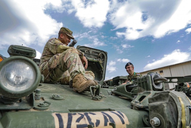 U.S. Army Sgt. Erick Johnson (left), an infantryman assigned to 1st Squadron, 2nd Cavalry Regiment, 7th Army Training Command, explains the capabilities of the Stryker armored vehicle to Croatian Armed Forces cadets at the Adriatic Sea Defense and...
