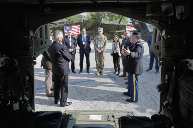 A joint defense delegation from North Macedonia discuss the capabilities of the Stryker armored vehicle with members of 1st Squadron, 2nd Cavalry Regiment, 7th Army Training Command, at the Adriatic Sea Defense and Aerospace exhibition in Split,...
