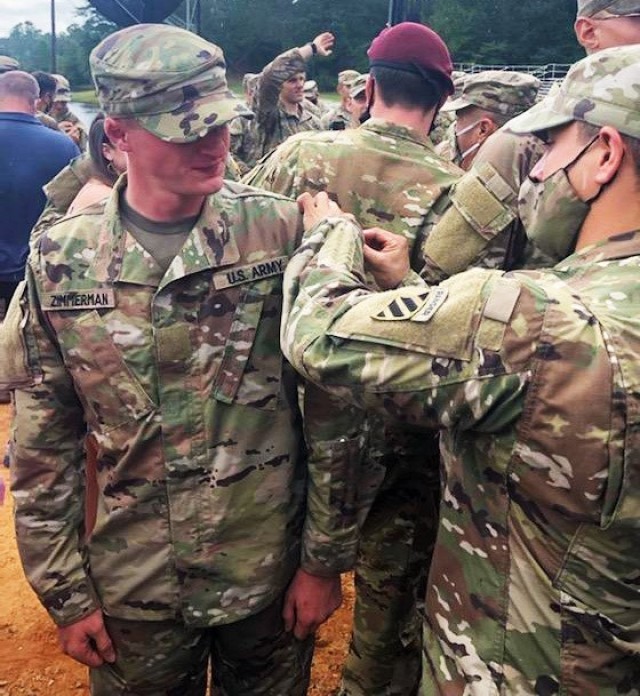 First Sgt. Betanzos, right, assigned to Headquarters and Headquarters Battalion, 3rd Infantry Division, pins the Ranger Tab on Sgt. Caleb Zimmerman, left, both assigned to 3rd Battalion, 67th Armor Regiment, "Spartan Brigade," 2nd Armored Brigade...