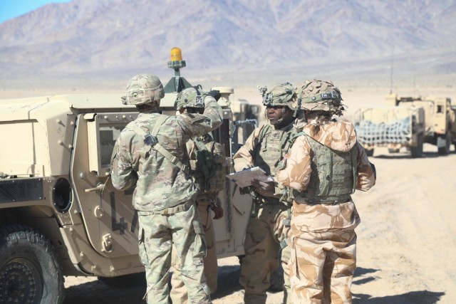 Military personnel of various units and nationalities perform land navigation operations during Decisive Action Rotation 20-04 at the National Training Center, Fort Irwin, Calif.  A 2020 Memorandum of Agreement signed between the U.S. Secretary of the Army and the U.K. Minister of Defence aims to ensure increased U.S.-U.K. technical interoperability as well as joint designs for systems that emphasize multi-domain operations in which both countries participate. 