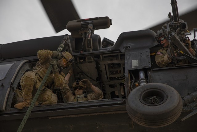 Australian Defence Force military personnel rappel out of a U.S. Army MH-60 Blackhawk helicopter during Exercise Talisman Sabre 21, at Royal Australian Air Force Base Tindal, Australia, July 17, 2021. Australian and U.S. forces combine biennially for Talisman Sabre, a month-long multi-domain exercise that strengthens allied and partner capabilities to respond to the full range of Indo-Pacific security concerns. (U.S. Army photo by Pfc. Matthew Mackintosh)