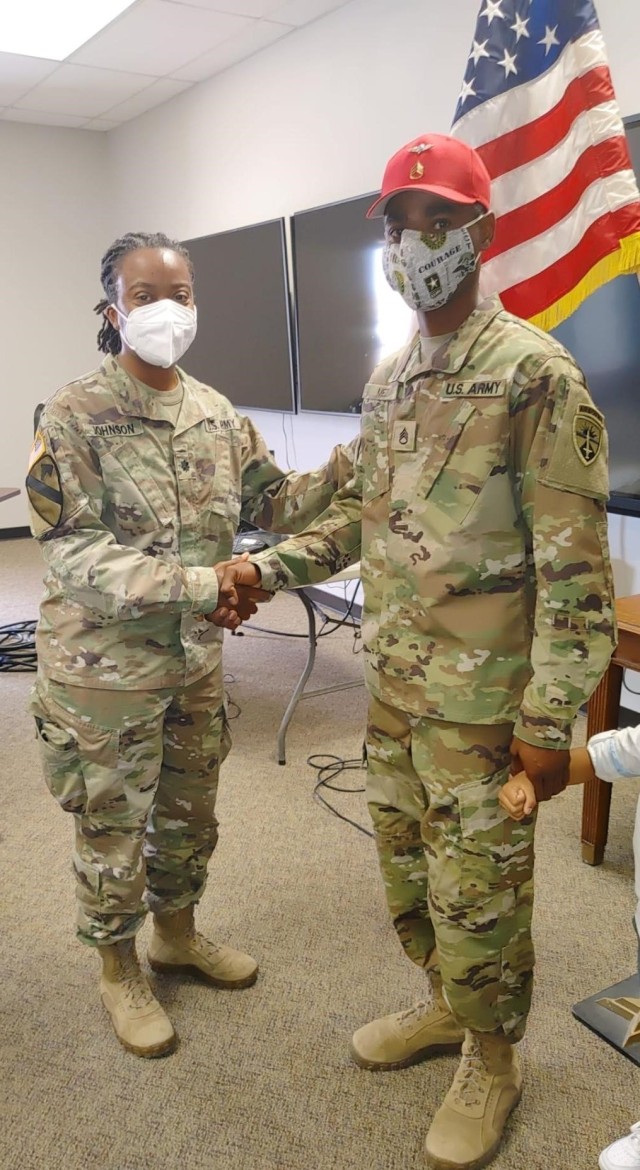 Yuma Test Center Commander Lt. Col. Alicia Johnson congratulates Staff Sgt. Jeffrey Mezi during his promotion ceremony last month. (Loaned photo)