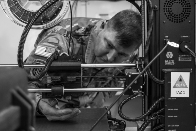 Chief Warrant Officer 3 Dewey Adams, an allied trades technician assigned to 194th Combat Sustainment Support Battalion, 2nd Sustainment Brigade, 520th Support Maintenance Company, operates the Army’s first 3D printer housed on Camp Humphreys, Republic of Korea, Oct. 29, 2018. (U.S. Army/Spc. Adeline Witherspoon, 2nd SBDE PAO)