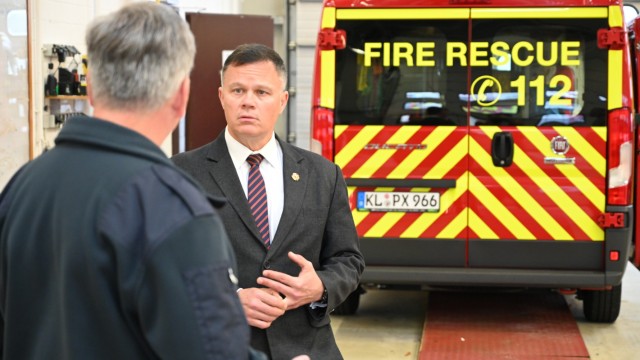 U.S. Army Garrison Rheinland-Pfalz Fire Chief William M. Maciorowski talks to Installation Management  Command-Europe Director Tommy Mize during a tour of the Sembach Kaserne, Germany, firehouse, Oct. 5, 2021. Maciorowski provided an update on the latest activities of the garrison fire team and discussed the condition of the Sembach facility. The tour lasted about 30 minutes.