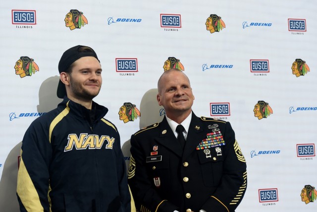 Chicago Blackhawks National Hockey League team honors Sgt. Maj. Dennis Koski, right, 85th U.S. Army Reserve Support Command, and U.S. Navy Veteran Lt. j.g. Ash Davis, during a home game, at the United Center in Chicago, October 1, 2021. 
(U.S. Army Reserve photo by Capt. Michael J. Ariola)