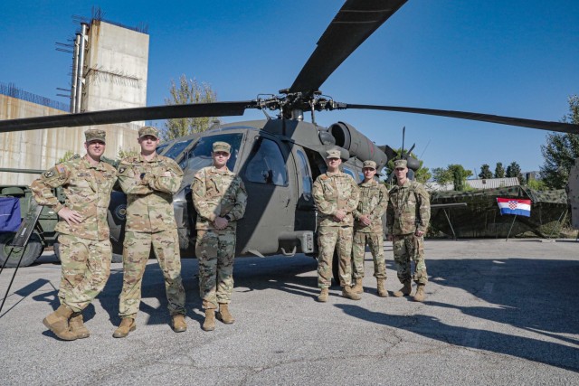 Members of 3rd Assault Helicopter Battalion, 1st Aviation Regiment, 1st Combat Aviation Brigade, 1st Infantry Division, gather for a photo during the Adriatic Sea Defense and Aerospace exhibition in Split, Croatia, Oct. 1, 2021. ASDA is a...