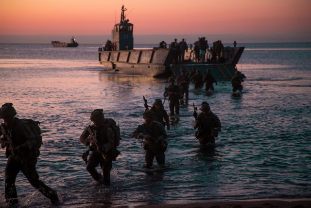 U.S. Marines with 1st Battalion, 7th Marine Regiment, conduct an amphibious landing during Exercise Talisman Sabre 21 in Ingham, Queensland, Australia, July 29, 2021. Amphibious operations provide a Combined-Joint Force Commander the capability to rapidly project power ashore in support of crisis response at the desired time and location. TS21 supports the Indo-Pacific Pathways initiative to advance a free and open Indo-Pacific by strengthening relationships and building trust and interoperability with allies and partners. (U.S. Marine Corps photo by Lance Cpl. Alyssa Chuluda)