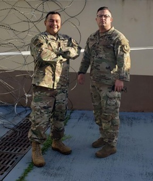 Sgt. 1st Class Aaron Mendez, left, and 1st Sgt. Ryan Dawson, both satellite communicators with Headquarters and Headquarters Company, U.S. Army Satellite Operations Brigade, U.S. Army Space and Missile Defense Command, stand outside their office building at Anderson Air Force Base, Guam. Both Soldiers recently took part in Forager 21 - a joint-forces exercise designed to test and refine the Theater Army’s ability to flow land power forces into the theater, execute command and control of those forces, and effectively employ them in support of our allies, partners, and national security objectives in the region. (U.S. Army photo courtesy of 1st Sgt. Ryan Dawson