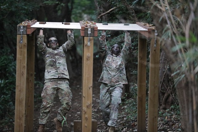 Sgt. Marino Cabral, left, assigned to 35th Combat Sustainment Support Battalion, competes in the obstacle course alongside 35th CSSB Command Sgt. Maj. Paul Denson during the unit’s first ever battalion-level “Best Warrior” competition Sept. 30 at Camp Zama, Japan.