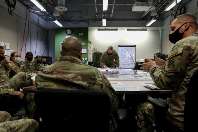 U.S. Army Soldiers from warfighting functions throughout the 3rd Infantry Division participate in a targeting working group during Warfighter 22-1 in the Mission Training Center on Fort Stewart, Georgia, Oct. 4, 2021. As a subordinate unit to the...