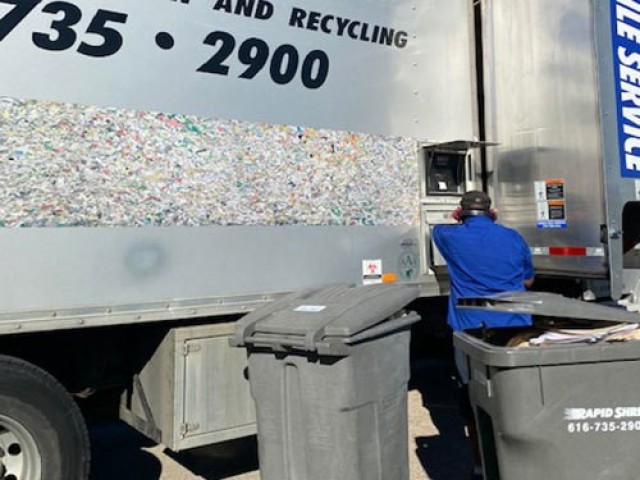A local Detroit shred company employee assists during the Detroit Arsenal, Michigan mass shred event in preparation for their upcoming Command Cybersecurity Readiness Inspection.  (Courtesy Photo)