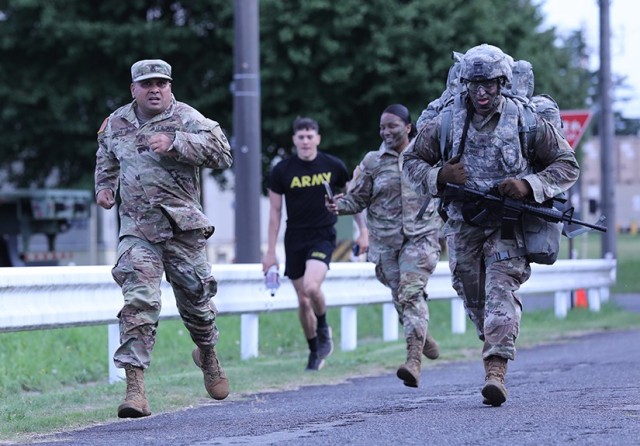 Sgt. Marino Cabral, right, assigned to the 35th Combat Sustainment Support Battalion, competes in the ruck march portion of the unit’s first ever battalion-level “Best Warrior” competition with support from his sponsor, Staff Sgt. Rabindra Thapa, left, Sept. 28 at Sagami General Depot, Japan.