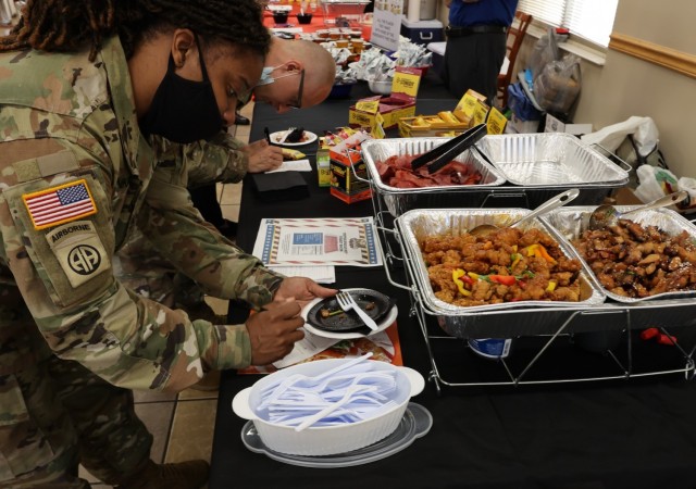 Soldiers enjoy tasting different new dining facility menu options Oct. 5, 2021 and fill out comment cards to express their thoughts about each one.