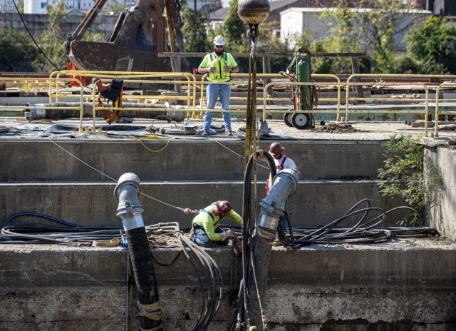 Contractors pump water out of the newly-constructed lock chamber at Charleroi Locks and Dam on the lower Monongahela River in Pennsylvania, Sept. 30, 2021. The U.S. Army Corps of Engineers Pittsburgh District recently finished building the new...