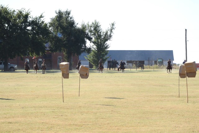 The 11th Armored Cavalry Regiment Horse Detachment team prepares to charge dismounted targets at the National Cavalry Competition, Fort Reno, Oklahoma, on September 22, 2021. The charge is the second phase of the Major Howze Cross-Country Team Competition, paying homage to the charge conducted by Maj. Howze, 11th Cavalry Regiment, on May 5, 1916.