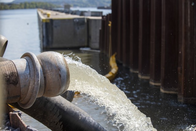 Contractors pump water out of the newly-constructed lock chamber at Charleroi Locks and Dam on the lower Monongahela River in Pennsylvania, Sept. 30, 2021. The U.S. Army Corps of Engineers Pittsburgh District recently finished building the new...