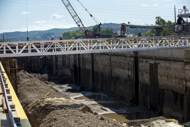 Kirk McWilliams and Shawn Soltis, resident and field engineers for the U.S. Army Corps of Engineers Pittsburgh District, walk across the newly-constructed chamber at Charleroi Locks and Dam on the lower Monongahela River in Pennsylvania, Sept. 30,...