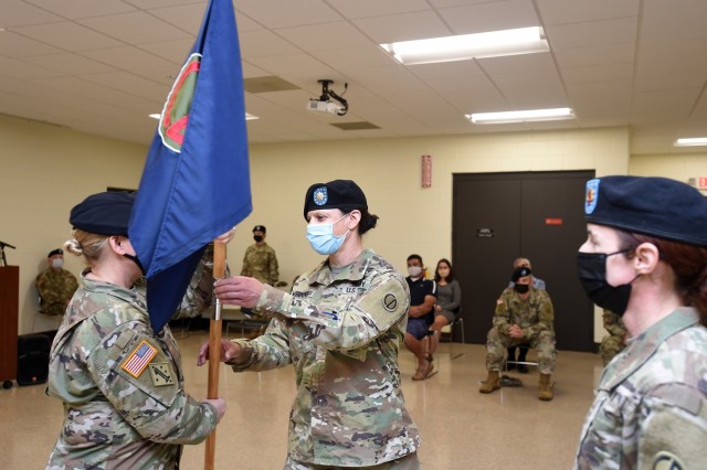 Maj Jody Wernikoff, right, incoming headquarters and headquarters company commander, receives the colors from Col. Stacy Cordell, Deputy Commanding Officer, 85th U.S. Army Reserve Support Command. Wernikoff assumed command of the 85th USARSC HHC,...