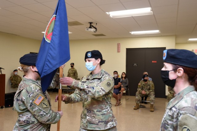 Maj Jody Wernikoff, right, incoming headquarters and headquarters company commander, receives the colors from Col. Stacy Cordell, Deputy Commanding Officer, 85th U.S. Army Reserve Support Command. Wernikoff assumed command of the 85th USARSC HHC, October 3, 2021. 
(U.S. Army Reserve photo by Capt. Michael Ariola)