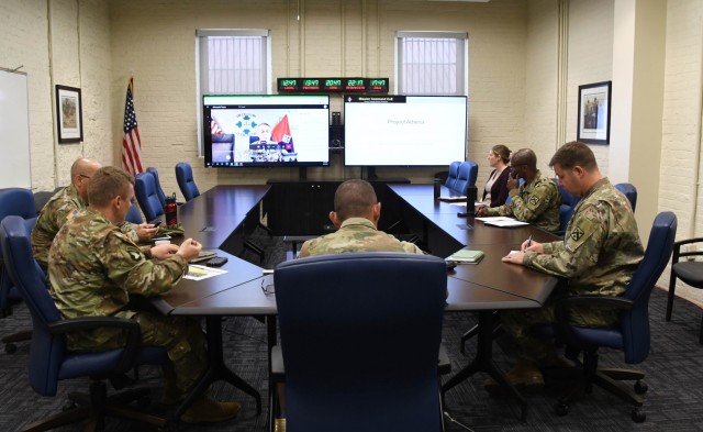 Mission Command Center of Excellence (MCCoE) Director Brig. Gen. Charles Masaracchia (center) and members of the MCCoE staff brief leaders with 1st Stryker Brigade Combat Team, 4th Infantry Division, on Project Athena May 25, 2021.  