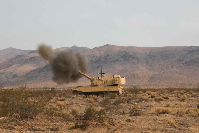 A U.S. Army Paladin from the 2nd Battalion, 3rd Field Artillery Regiment, 1st Armored Brigade Combat Team, 1st Armored Division, fires a round during Decisive Action Rotation 21-10 at the National Training Center, Fort Irwin, California, Sept. 22. Decisive action rotations ensure Brigade Combat Teams remain versatile, responsive and consistently available for current and future contingencies. U.S. Army photo by Spc. Kyle Goines, Operations Group, National Training Center.