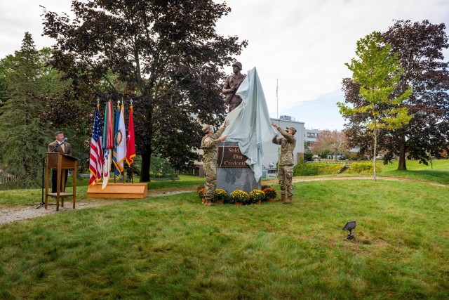 Soldiers unveil the new Soldier Statue during a rededication ceremony on Oct 6, 2021 at Natick Soldi