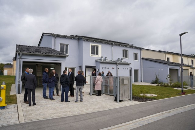 Members of USAG Bavaria, U.S. Army Corps of Engineers and contractors that worked on phase two of the Rose Barracks housing project tour the newly constructed homes after a ribbon-cutting ceremony at Rose Barracks, Oct. 6, 2021. (U.S. Army photo by Julian Temblador)