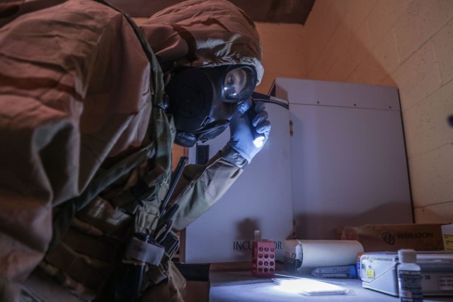 A Chemical, Biological, Radiological and Nuclear specialist from the 2nd Chemical Battalion looks for potential biohazards during Decisive Action Rotation 21-10 on Fort Irwin, California, Sept. 16. The 2nd Chemical Battalion is part of the 48th Chemical Brigade and 20th Chemical, Biological, Radiological, Nuclear, Explosives (CBRNE) Command. U.S. Army Photo by Cpl. Khari Bridges, Operations Group, National Training Center.