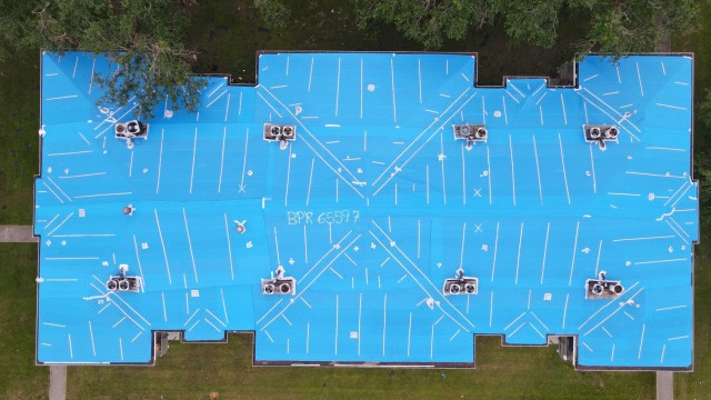 Aerial footage showing U.S. Army Corps of Engineers' installation of temporary, fiber-reinforced plastic sheeting, "blue roofs," on homes damaged by Hurricane Ida, Gretna, Louisiana. (Photo courtesy of USACE contractor)