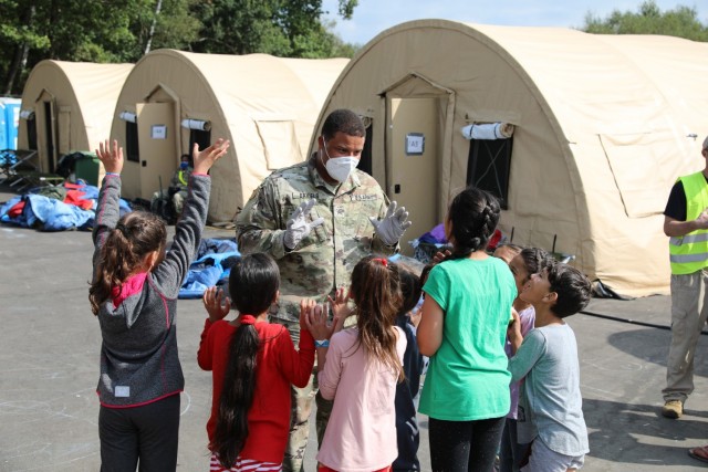 Soldiers from 21st Theater Sustainment Command provide security and assistance to Afghan evacuees at the transit area known as pod 51 on Ramstein Air Base September 9, 2021. The transit center provides a safe place for the evacuees to complete...