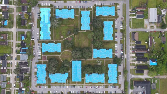 Aerial footage showing U.S. Army Corps of Engineers' installation of temporary, fiber-reinforced plastic sheeting, "blue roofs," on homes damaged by Hurricane Ida, Gretna, Louisiana. (Photo courtesy of USACE contractor)