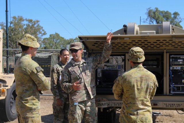 2nd Lt. Nicholas Sidow, a signal corps. officer assigned to the Signal Intelligence Sustainment Company, Headquarters and Headquarters Battalion, 4th Infantry Division, interacts with his Australian Army counterparts during Exercise Talisman...