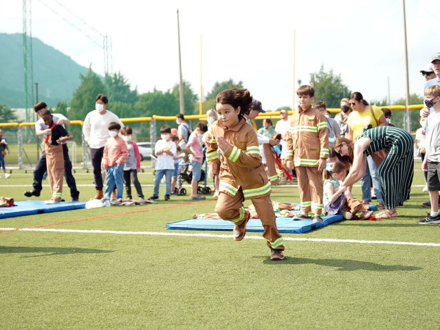 A young boy sprints forward during an junior firefighters obstacle course event at Camp Walker, Republic of South Korea. The event was just one of many hosted by USAG Daegu Emergency Services during an open house on October 9th, 2021.