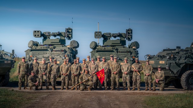 Crews from Alpha Battery, 5-4 ADAR pose with their Maneuver Short Range Air Defense system after successfully completing the first live-fire of M-SHORAD at the tactical unit level and the first-ever live-fire of the system in Europe on Oct. 7, 2021. The week-long training took place at the Putlos Bundeswehr range on the Baltic Sea coast of Germany. (U.S. Army photo by Maj. Robert Fellingham)