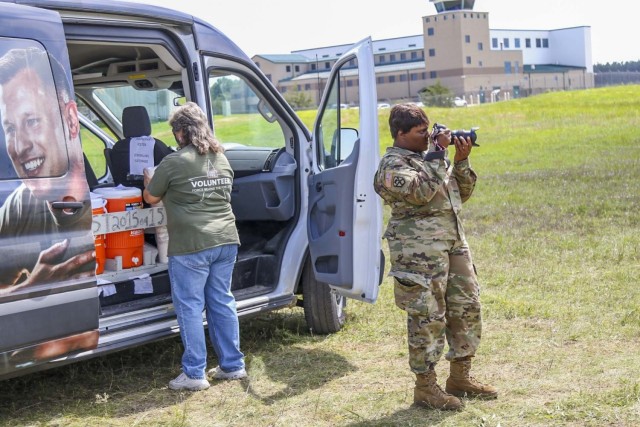Spc. Salome DeNoon, 326th Mobile Public Affairs Detachment public affairs mass communications specialist, snaps a photo at Combat Support Training Exercise 78-21-04 on Aug. 12, 2021 at Fort McCoy, Wisconsin. CSTX will enable Army Reserve units to...
