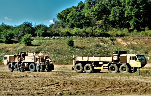 Soldiers at Fort McCoy, Wis., for training in the Regional Training Site-Maintenance Wheeled-Vehicle Recovery Operations Course work together during training Sept. 23, 2021, at the installation Vehicle Recovery Site on North Post. The 17-day...