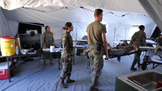 U.S. Army Reserve medics move a Tactical Combat Casualty Care Exportable mannequin out of the hospital to a helicopter for medivac training on Aug. 13 2021 at Fort McCoy Wis.