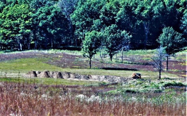 Fort McCoy Range Maintenance personnel are shown Sept. 23, 2021, constructing a fire and movement range on Range 4 at Fort McCoy. The smaller range is 100 meters wide by 150 meters long. The new range also is designed for training individual...
