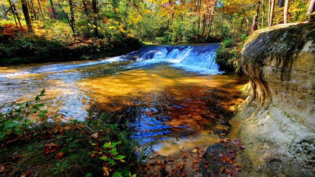 A scene of Trout Falls on the La Crosse River in the Pine View Recreation Area is shown with fall colors Sept. 30, 2021, at Fort McCoy, Wis. The recreation area includes acres of publicly accessible land with hiking trails, Pine View Campground,...