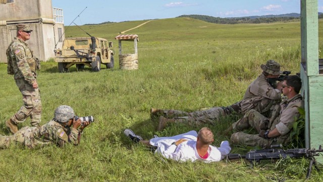 Spc. Marcel Bassett, a public affairs mass communications specialist with 326th Mobile Public Affairs Detachment, takes photos during Combat Support Training Exercise 78-21-04 at Fort McCoy, Wisconsin on Aug. 13, 2021. The Soldiers with the 3rd...