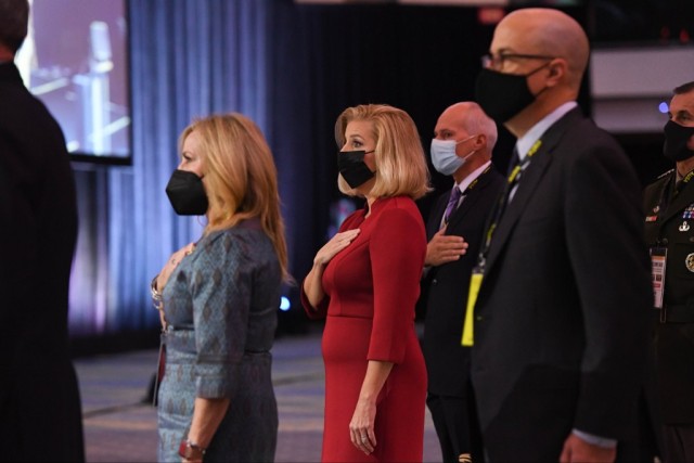 Secretary of the Army Christine E. Wormuth, center, participates in the opening ceremony to kick off the Association of the U.S. Army Annual Meeting and Exposition in Washington, D.C., Oct. 11, 2021.