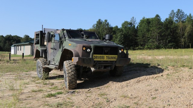 Joint Light Tactical Vehicle driver's training students learn about the flexibility of the suspension and central tire inflation system at the obstacle course at Fort McCoy, Wis., Sept. 1, 2021. (U.S. Army photo by Sgt. Bill Washburn/88th...