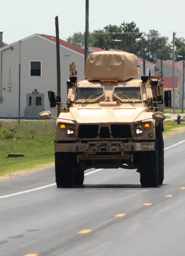 Personnel drive a Joint Light Tactical Vehicle (JLTV) through the cantonment area July 1, 2021, at Fort McCoy, Wis. The JLTV family of vehicles is designed to restore payload and performance that were traded from light tactical vehicles to add...