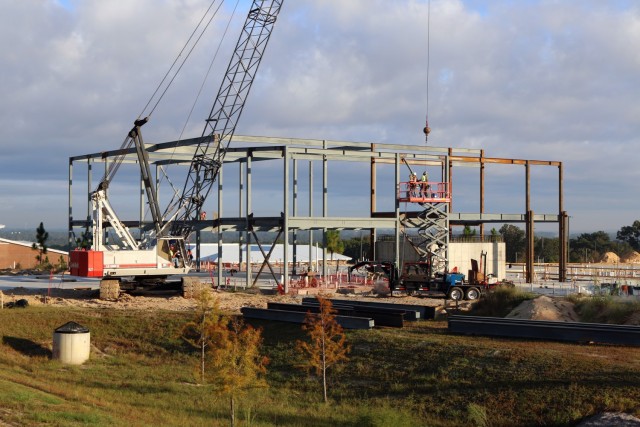Workers put in a structural steel frame for a company-sized barracks at Fort Jackson, South Carolina as part of the Basic Training Complex Four, Phase Two project.  Formally known as a Basic Combat Trainee Complex, it has all the required...
