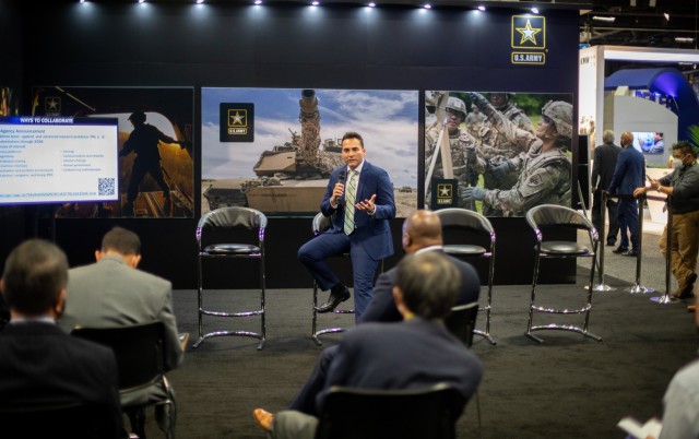 Mr. Ruben Cruz, Army Futures Command Artificial Intelligence Integration Center (AI2C), speaks to the audience at an AUSA 2021 Warriors Corner on Oct. 11 on how AI2C is supporting the DOD’s Joint Artificial Intelligence Center & serves as an integrator for various AI science, technology & developmental engineering efforts distributed across the Army Modernization Enterprise