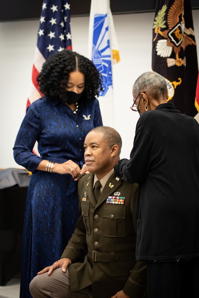 Mrs. Nicholle Sullivan, Esq., left, and Ms. Clementine Sullivan, right, pin the rank of Brigadier General upon Brig. Gen. Ronald Sullivan during his promotion ceremony Monday, October 4 at the National Museum of the United States Army.  

A graduate of Howard University and The University of Kansas, School of Law, Sullivan’s distinguished career spans over 28 years.  He will serve as the Chief Judge for U.S. Army Court of Criminal Appeals (Individual Mobilization Augmentee).