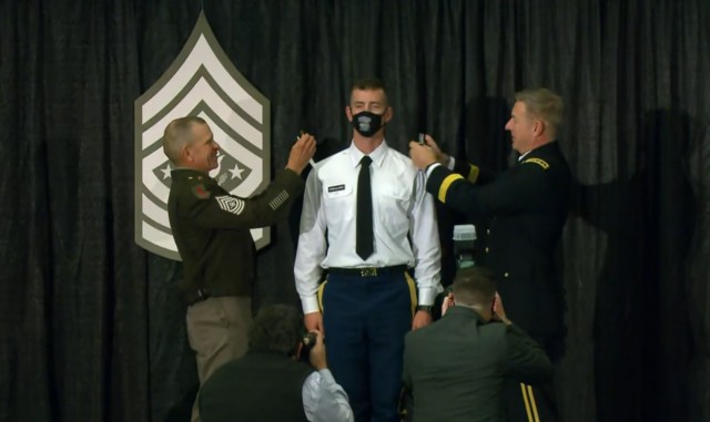Chief of Staff of the Army Gen. James C. McConville, right, and Sgt. Maj. of the Army Michael A. Grinston promote Sgt. Adam Krauland, the Army&#39;s 2021 NCO of the Year, to the rank of staff sergeant at the at the Association of the U.S. Army Annual Meeting and Exposition in Washington, D.C., Oct. 13, 2021. 