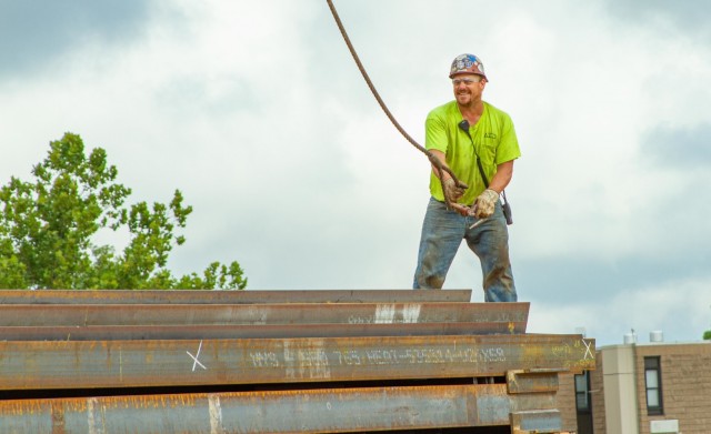 A U.S. Army Corps of Engineers, Kansas City District Missouri Resident Office Hospital contractor attaches a crane hook to a piece of steel in preparation of moving it on site of the new hospital at Fort Leonard Wood, Mo., on Sept. 1, 2021.